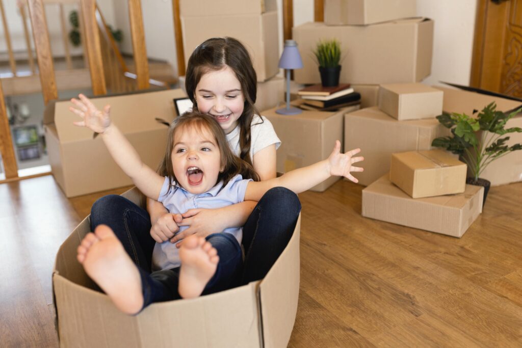 full-shot-kid-sitting-box-featured image