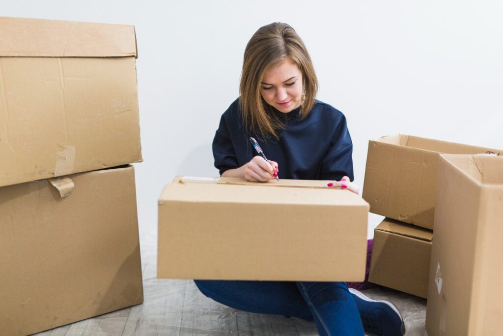 young woman doinig checklist for moving out