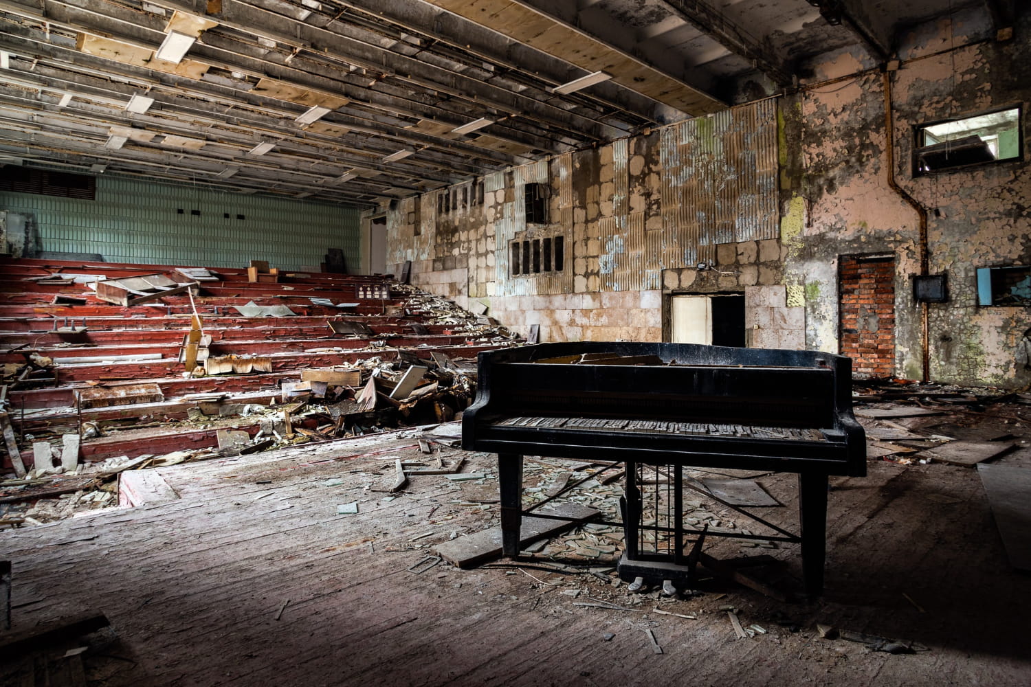 broken grand piano in an old stage - featured image